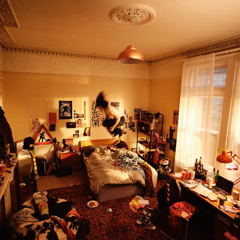 Cover of Cannonball by Man/Woman/Chainsaw, showing a room lit in orange