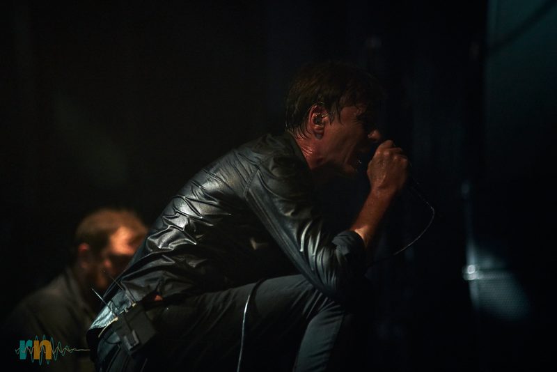 Brett Anderson, singer of Suede, crouching during the concert in Murcia