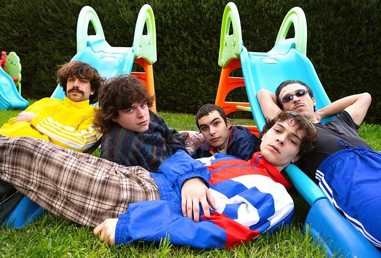 The five members of Construimos Escaleras gathered in a park