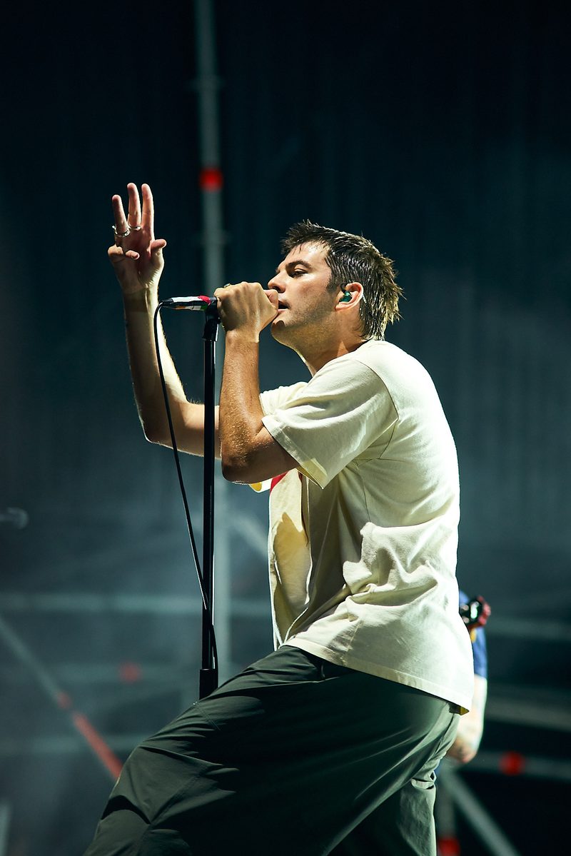 The Fontaines D.C. singer raises one hand while performing in profile in Alicante, Spain.