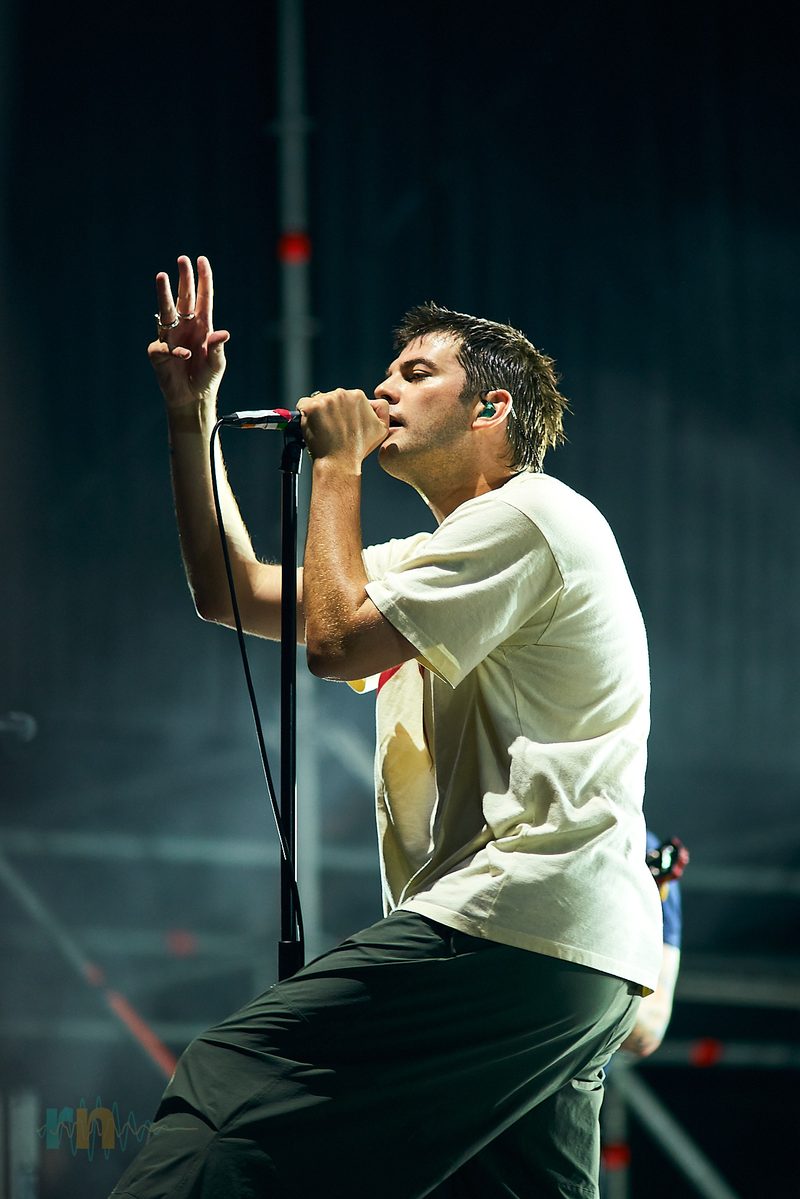 The Fontaines D.C. singer raises one hand while performing in profile in Alicante, Spain.